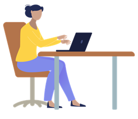 Woman sitting at a desk, working on a laptop