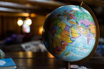 Photo of a colorful globe with dim backlighting