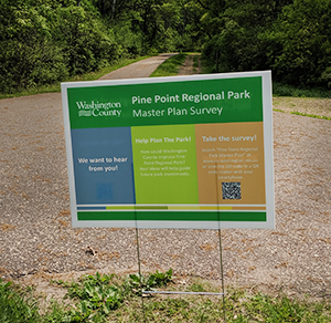 Sign at park promoting an online survey