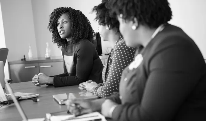 Photo of three women in a meeting. Photo by Christina @wocintechchat at unsplash