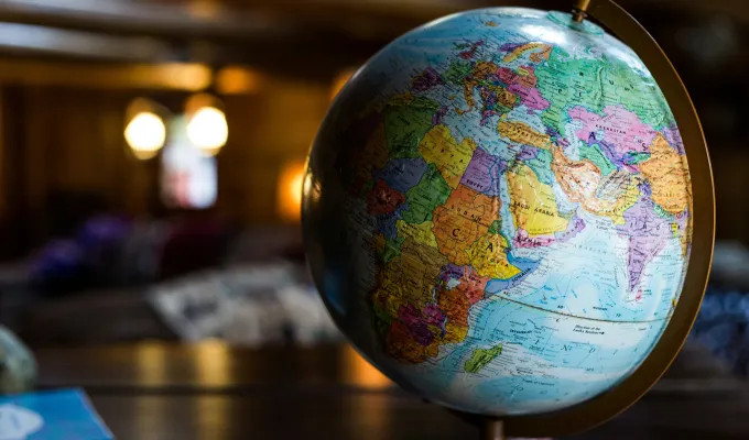 Photo of a colorful globe with dim backlighting