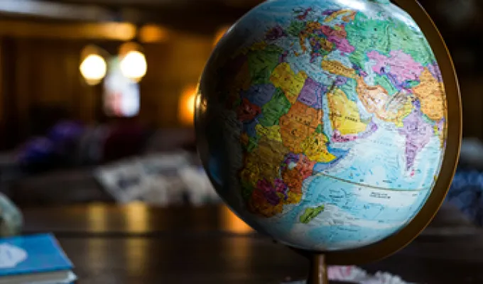 Photo of a globe with dark backlighting