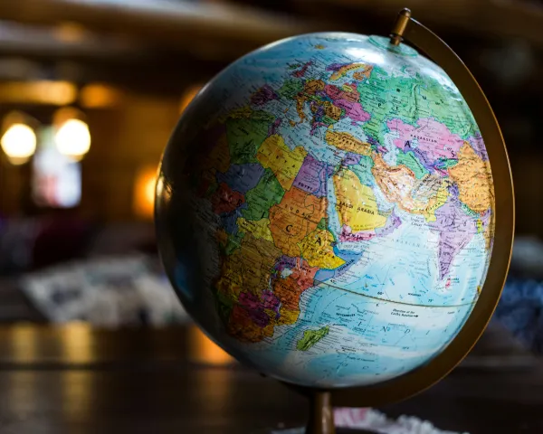 Photo of a colorful globe with dim backlighting