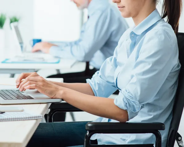 Photo of a woman working at a laptop