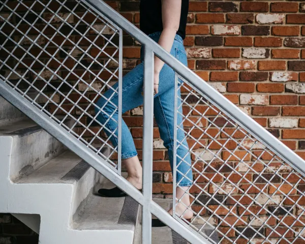 Photo of a woman walking up stairs