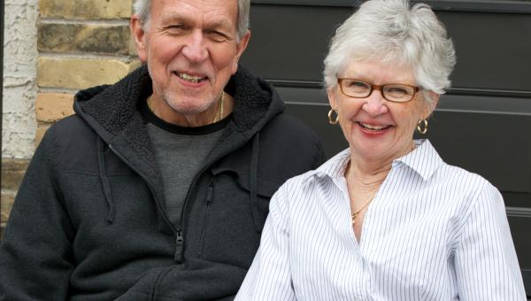 Older couple sitting on front step