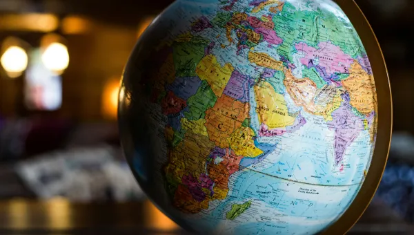 Photo of a colorful globe with dim backlighting